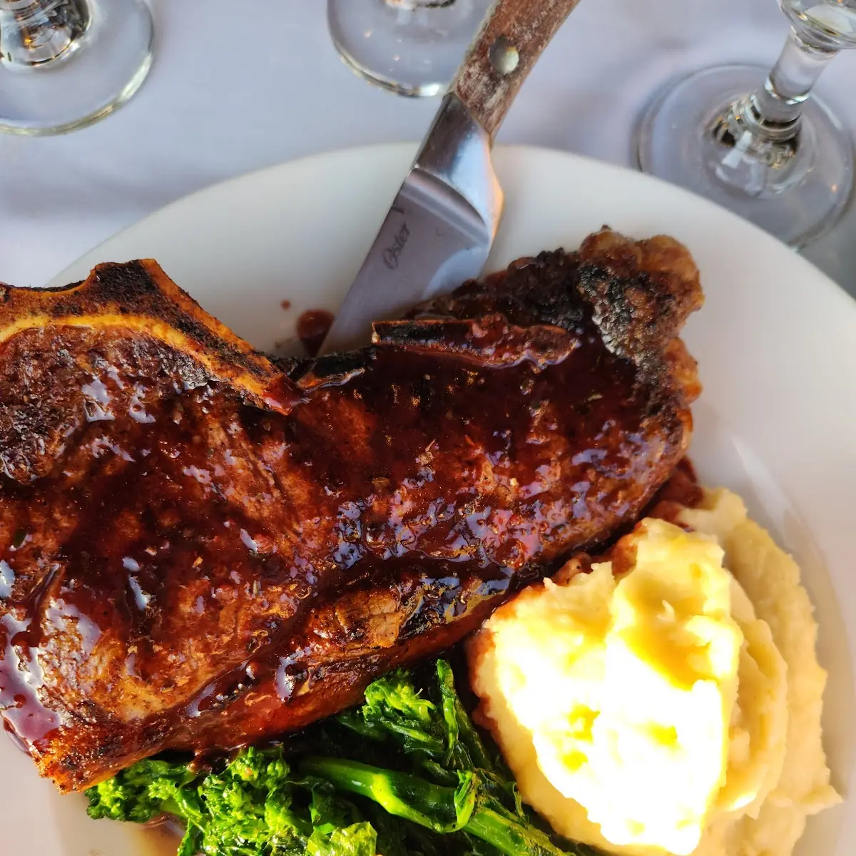 Bone-In Ribeye Steak with Mashed Potatoes and Broccoli Rabe