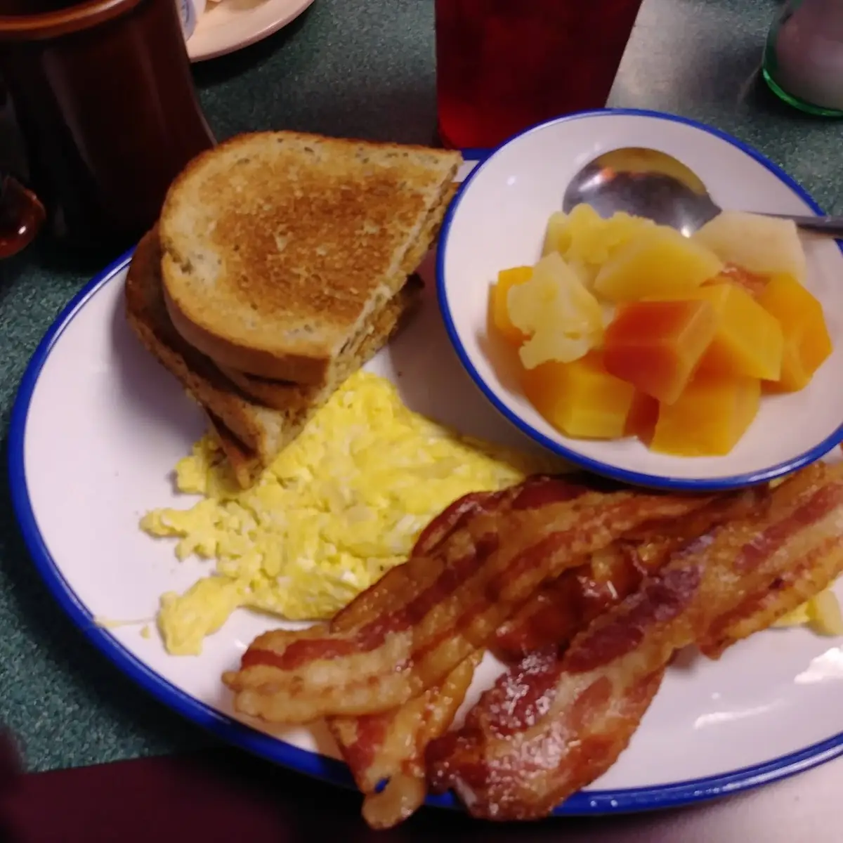 Two Eggs Bacon Toast and Fruit