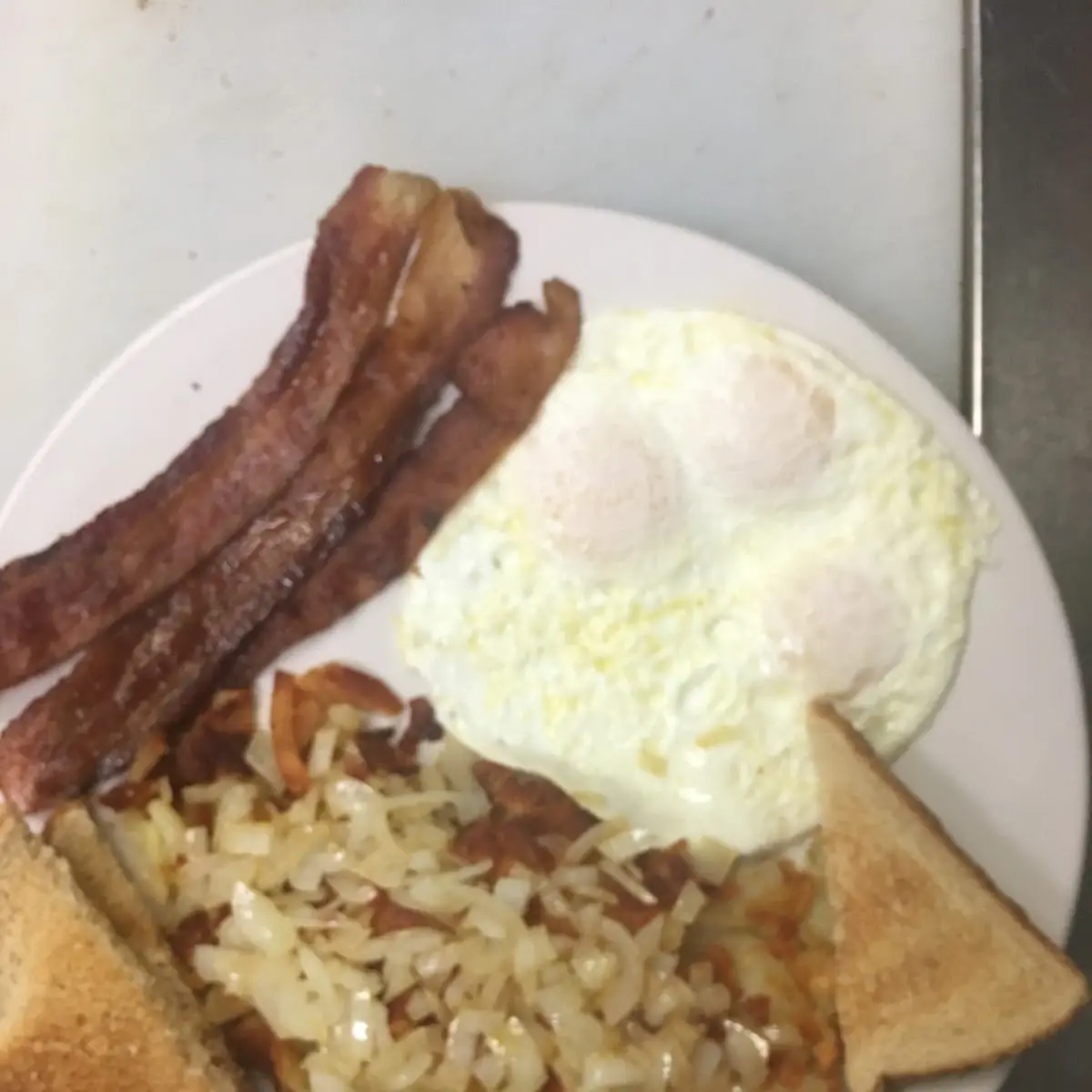 Eggs Bacon Hash Browns and Toast