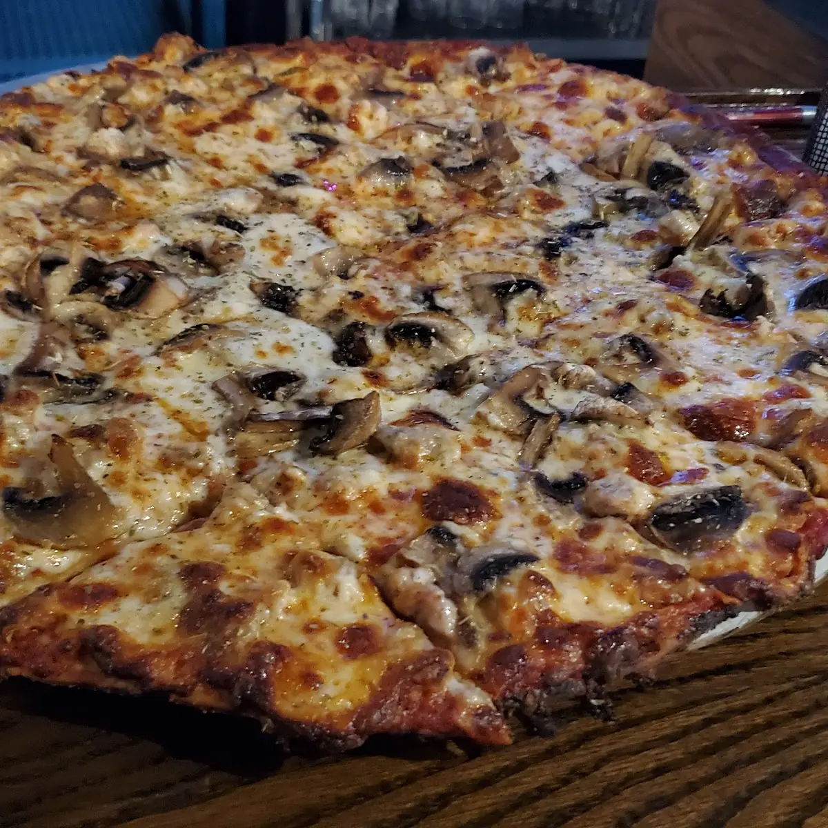 Thin Crust Pizza with Sausage and Mushrooms