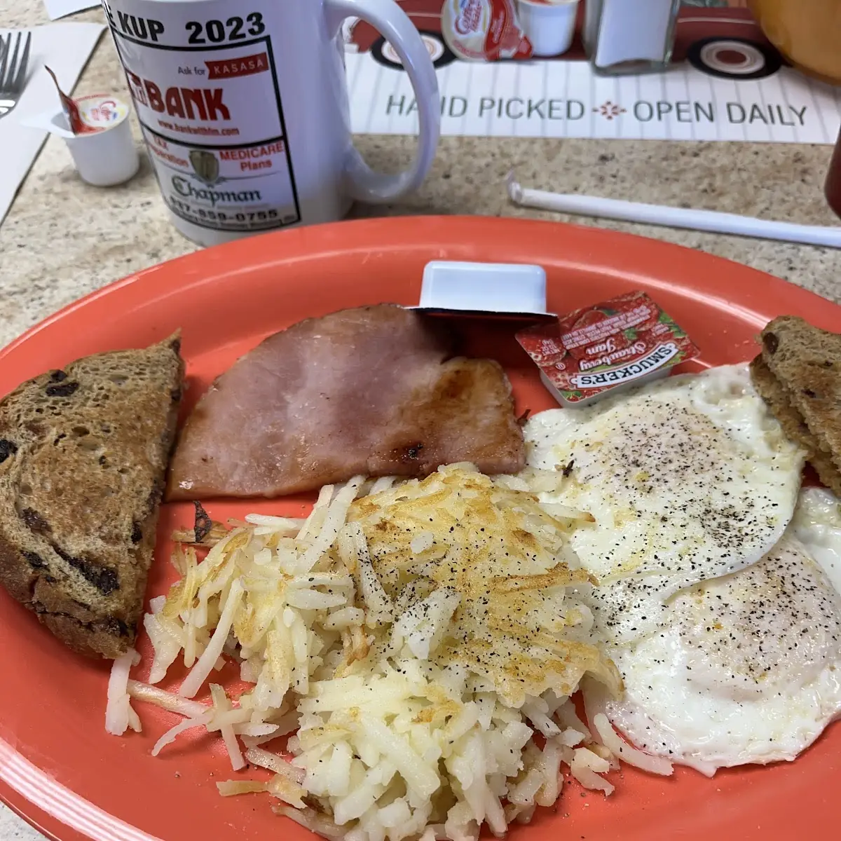 Eggs over Easy with Ham Hash Browns and Raisin Toast