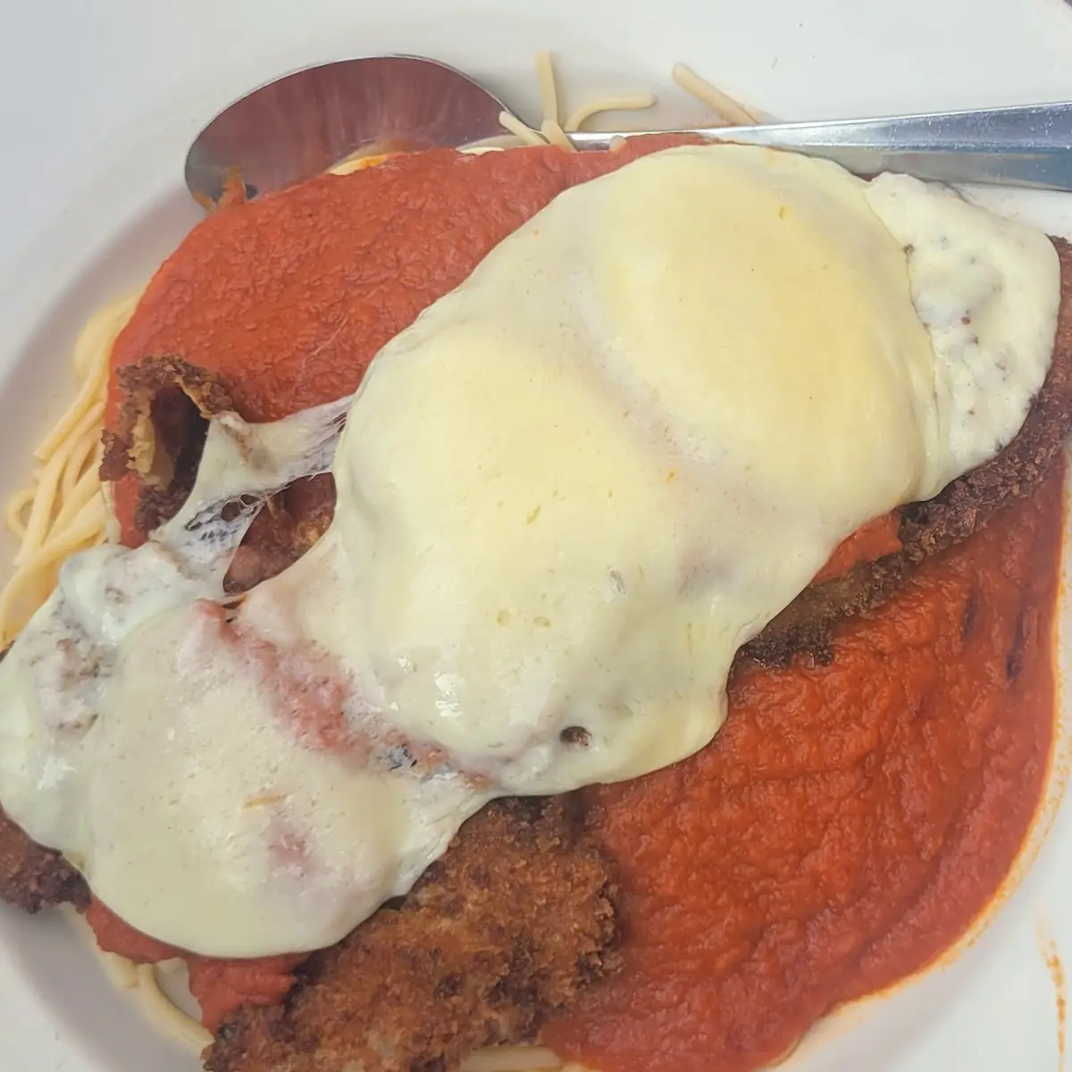 Veal Parmesan over Pasta