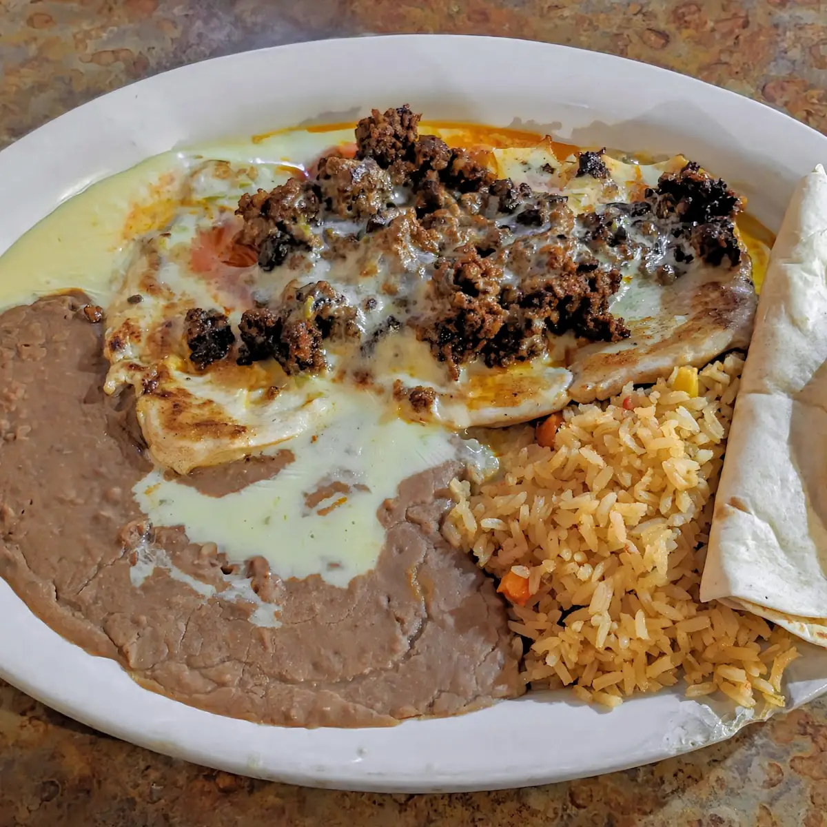 Two Enchiladas Rice & Beans