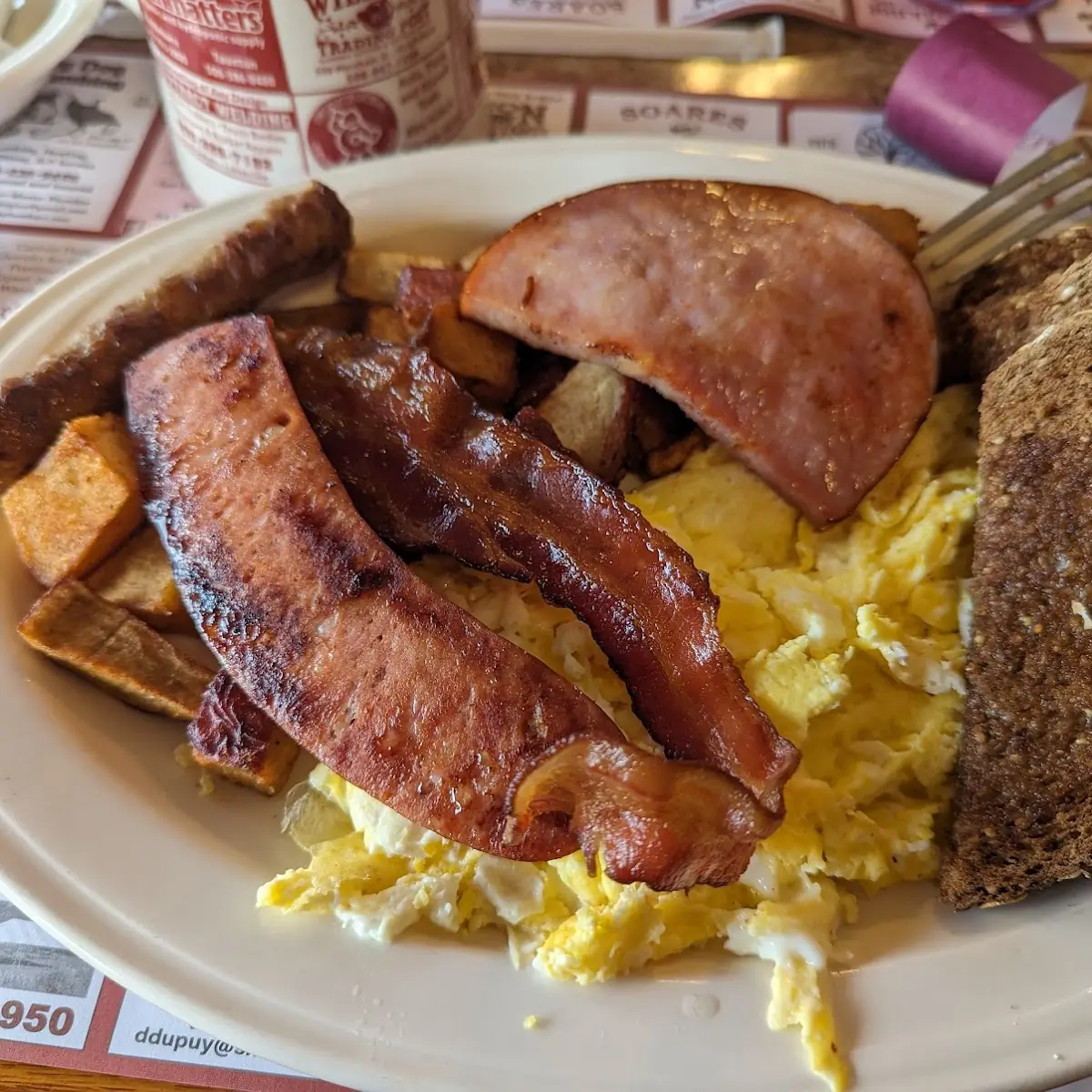 3 Egg Linguiça Ham Bacon Home Fries and Multi Grain Bread