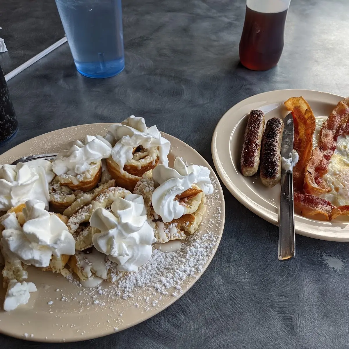 Cinnamon Roll Pancakes Sausage Links Eggs over Medium and Hash Browns