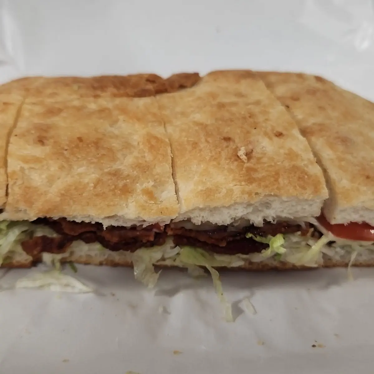Turkey Bacon Lettuce Tomato and Red Onion on a Panini Bread