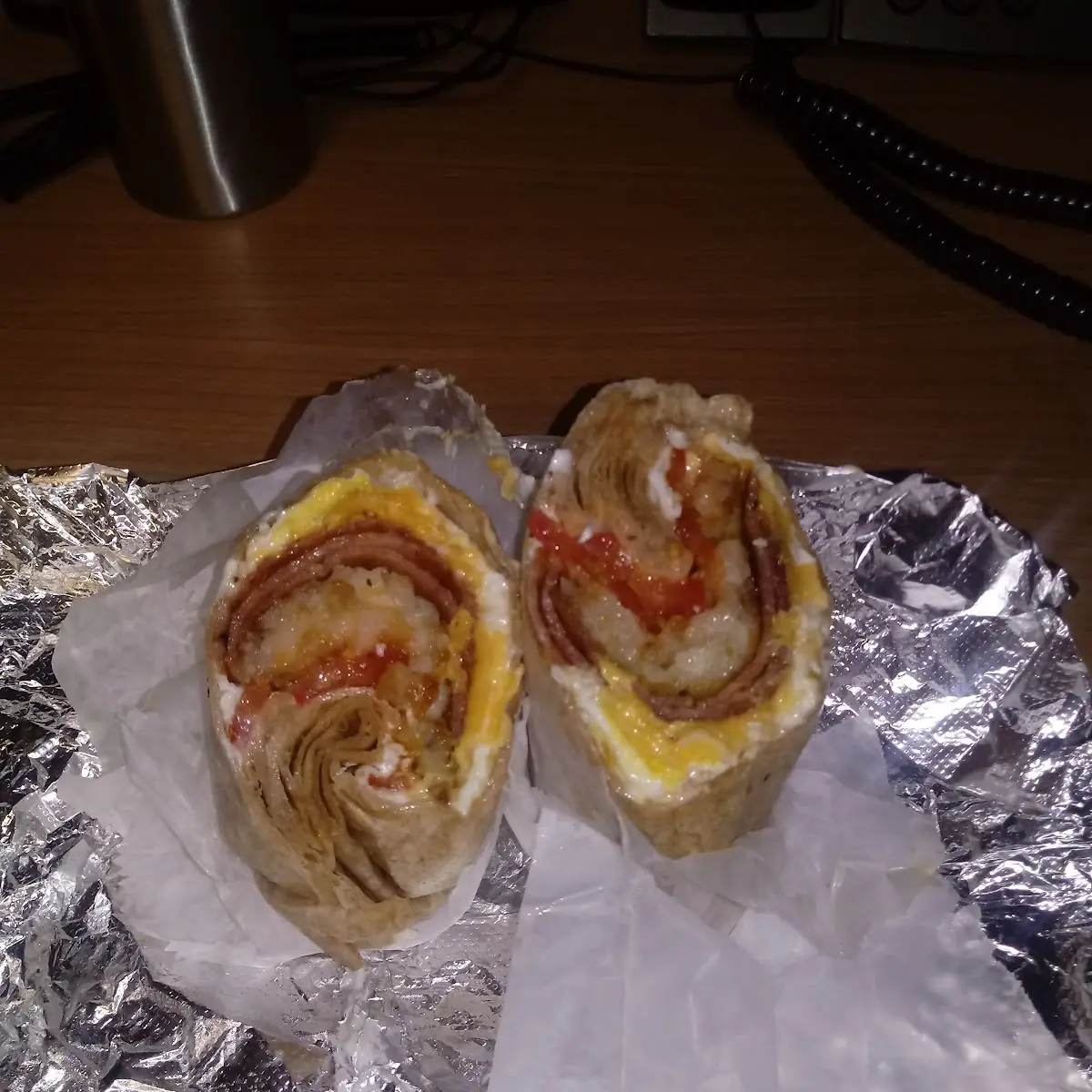 Taylor Ham Egg and Cheese in a While Wheat Wrap with Tomato Hash Browns and Salt Pepper and Mayo