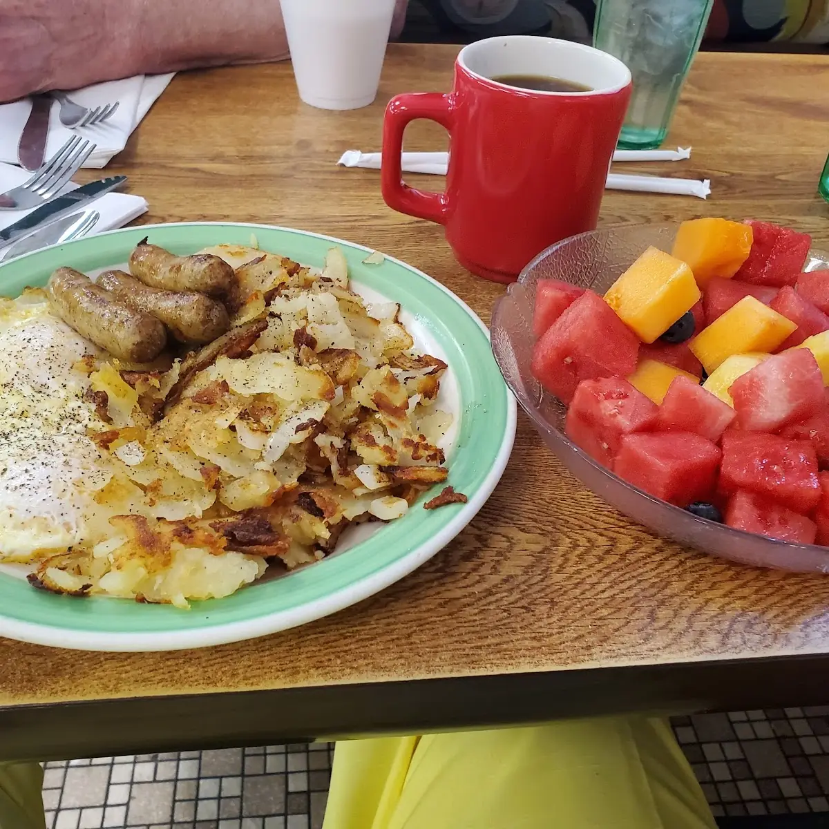 Fresh Fruit Eggs over Medium Turkey Sausage Potatoes with Onions Coffee