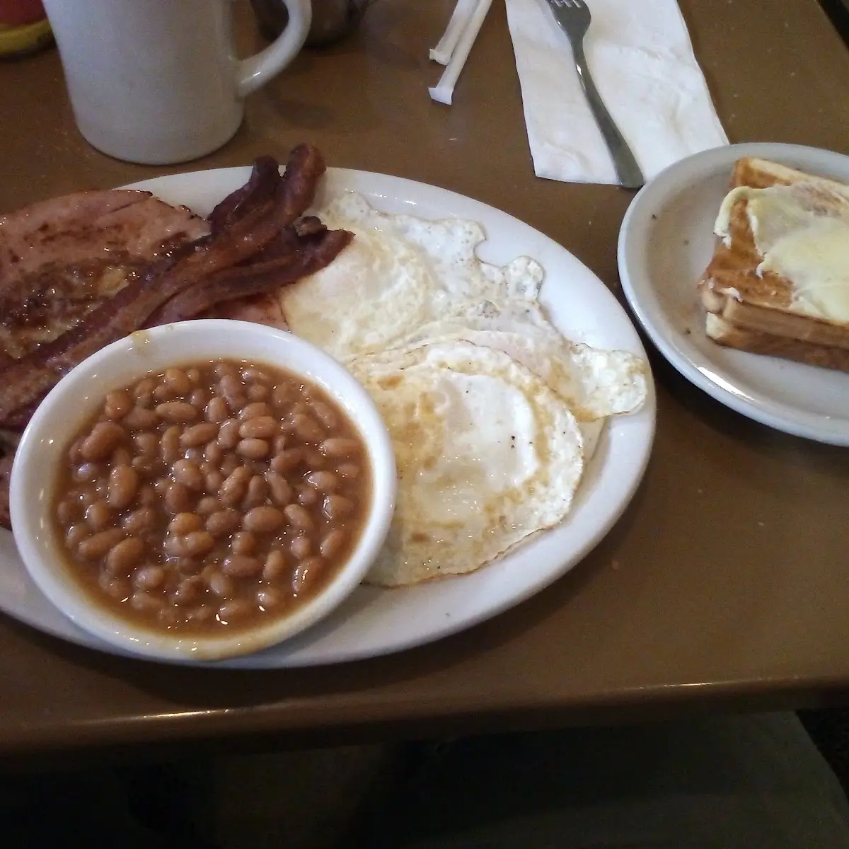 2 Dropped Eggs on Wheat with Sausage Links and Beans