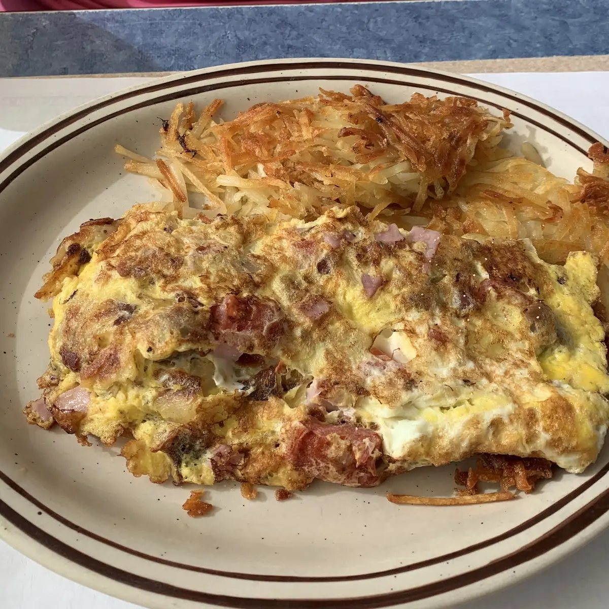 Pancake Taco Bacon Scrabble Eggs Cheddar Cheese and Hash Brown