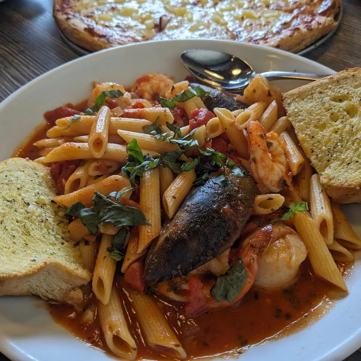 Penne Pasta with Seafood and Garlic Bread