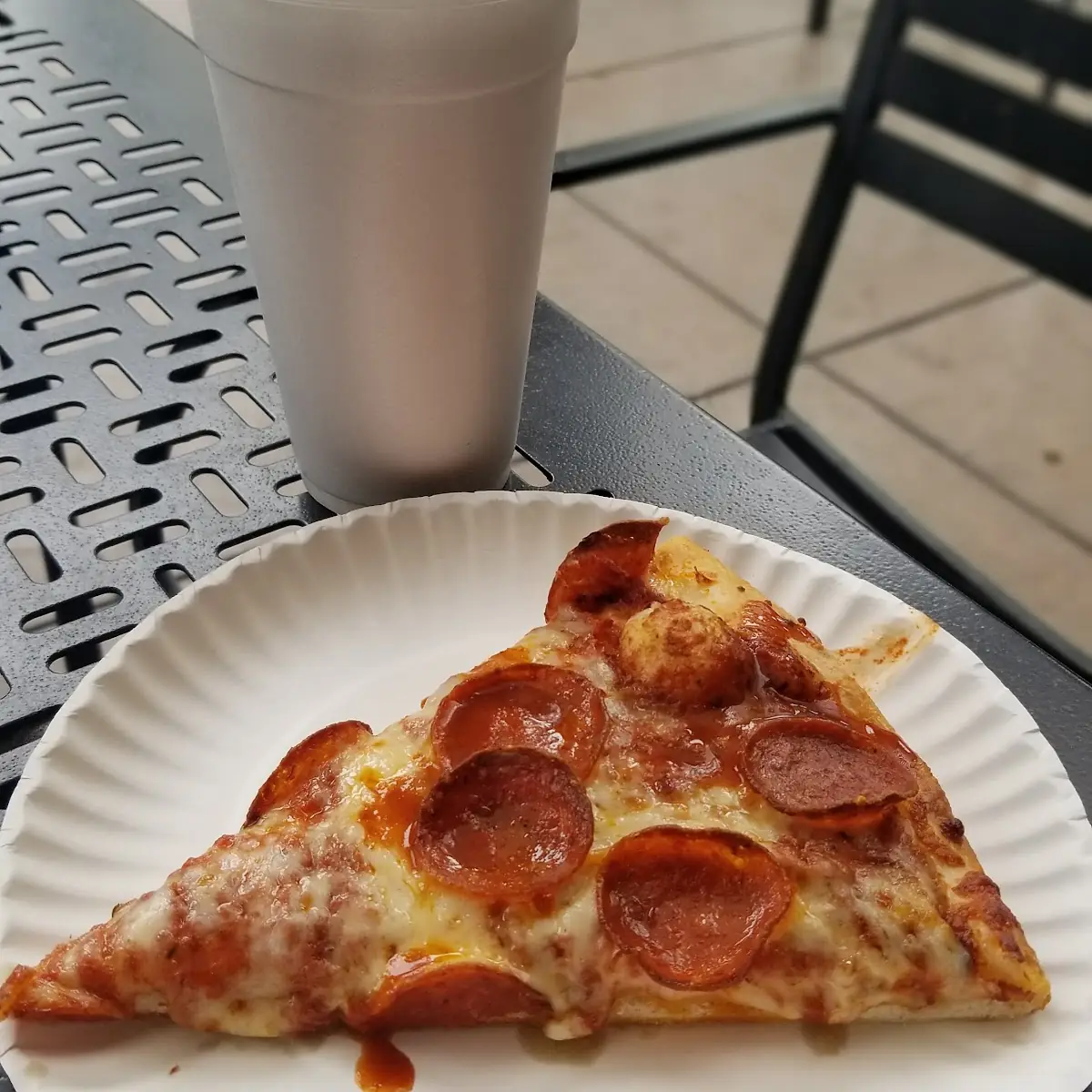 Pepperoni Pizza Slice with Tapatio Hot Sauce