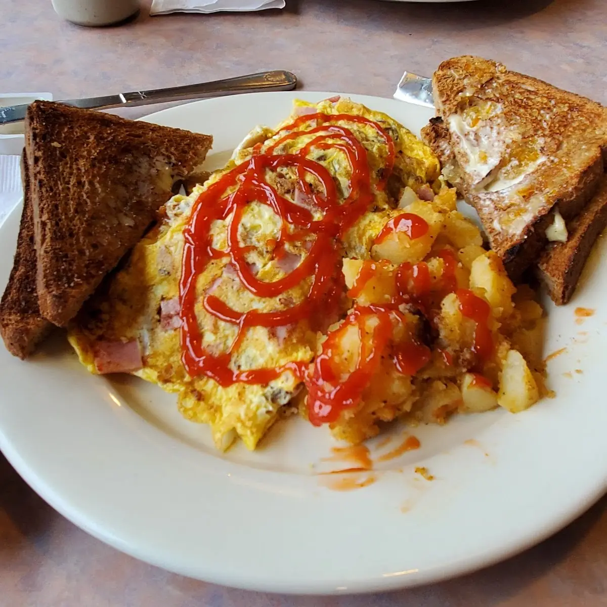 Bacon Sausage Ham and Cheddar Omelet