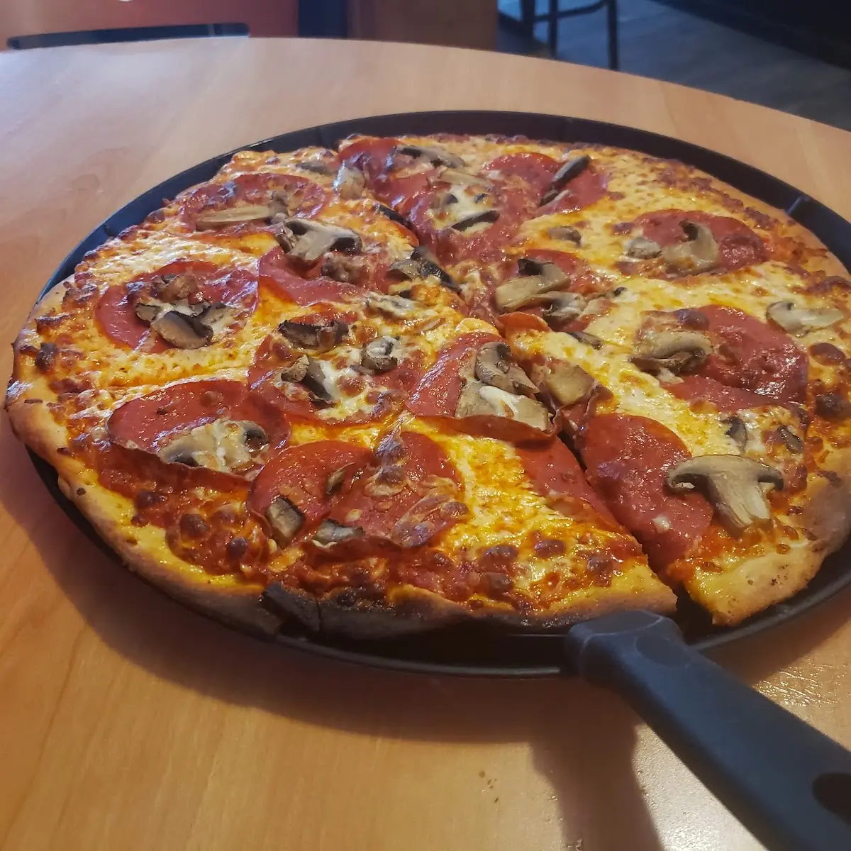 Thin Crust Pepperoni and Mushroom Pizza