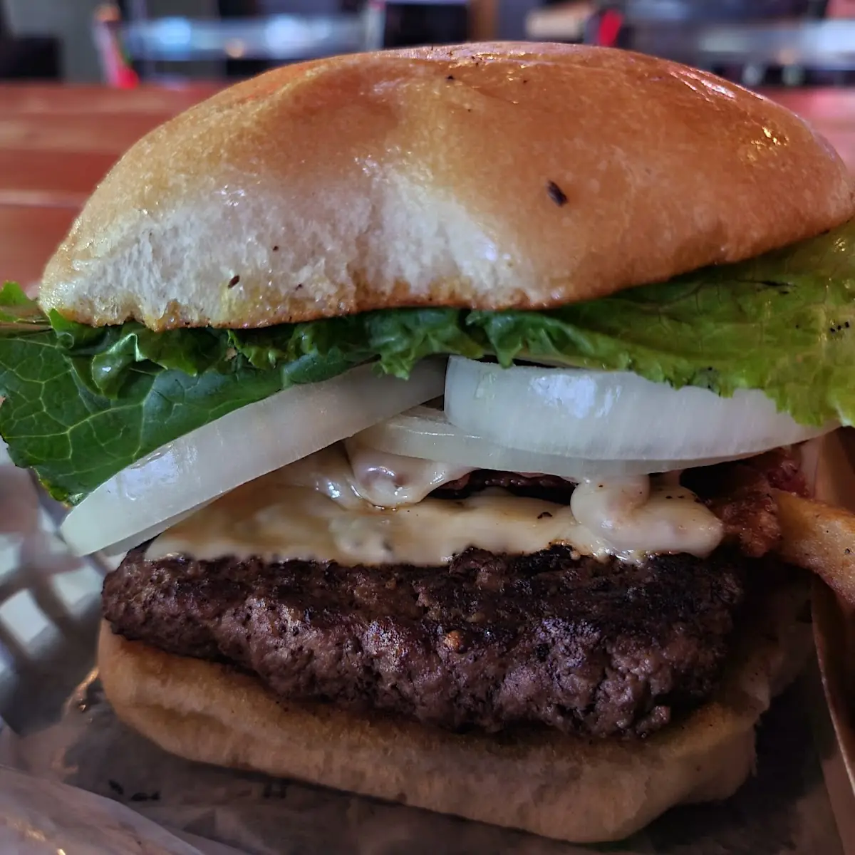 Half Pound Burger with Bacon and Pepper Jack Cheese and Fries