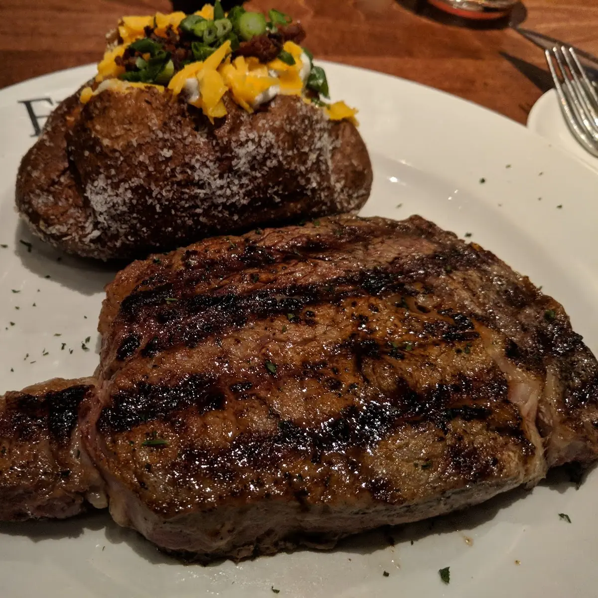 16oz Aged Ribeye Steak with Baked Potato