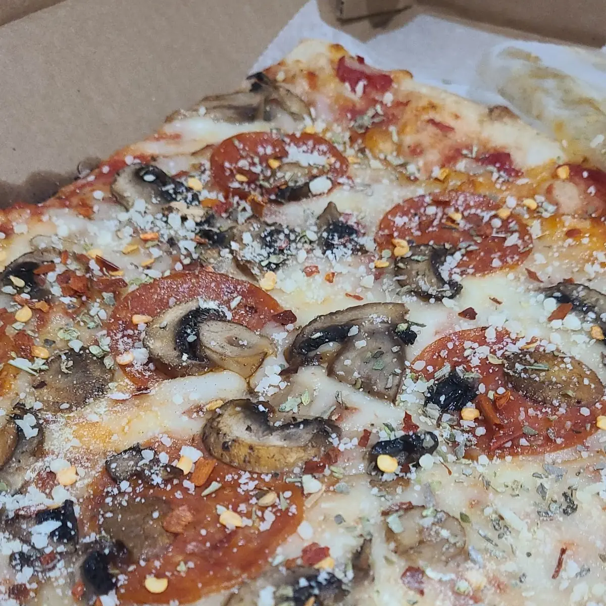 Mushroom Pepperoni and Olive Pizza by the Slice