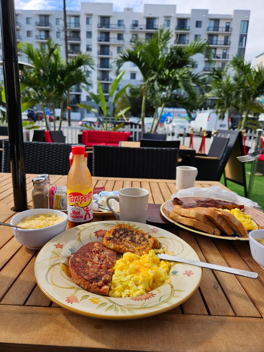 Corned Beef Hash with Eggs Hash Browns and Chessey Grits