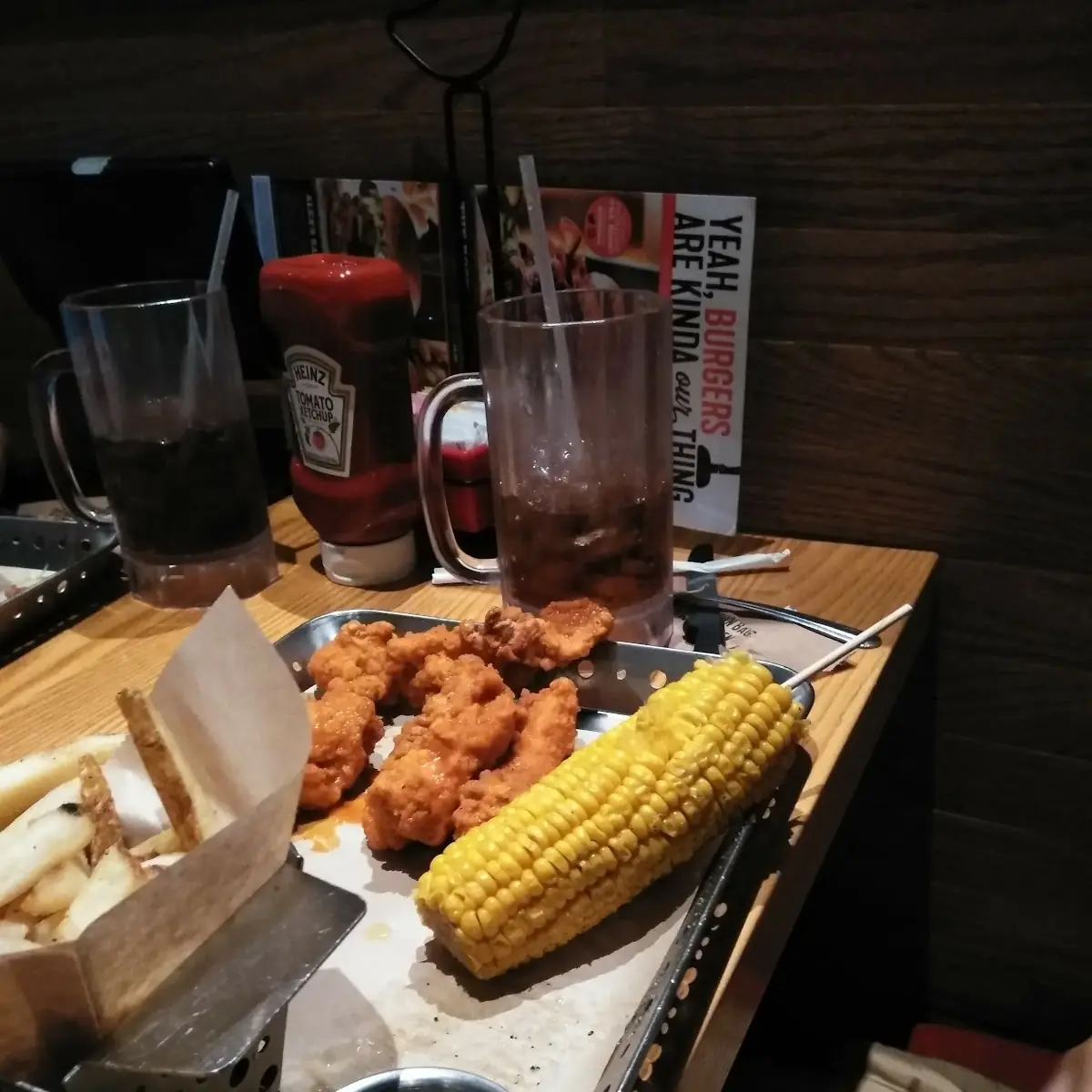 Chicken Strips Corn on a Cob and Fries