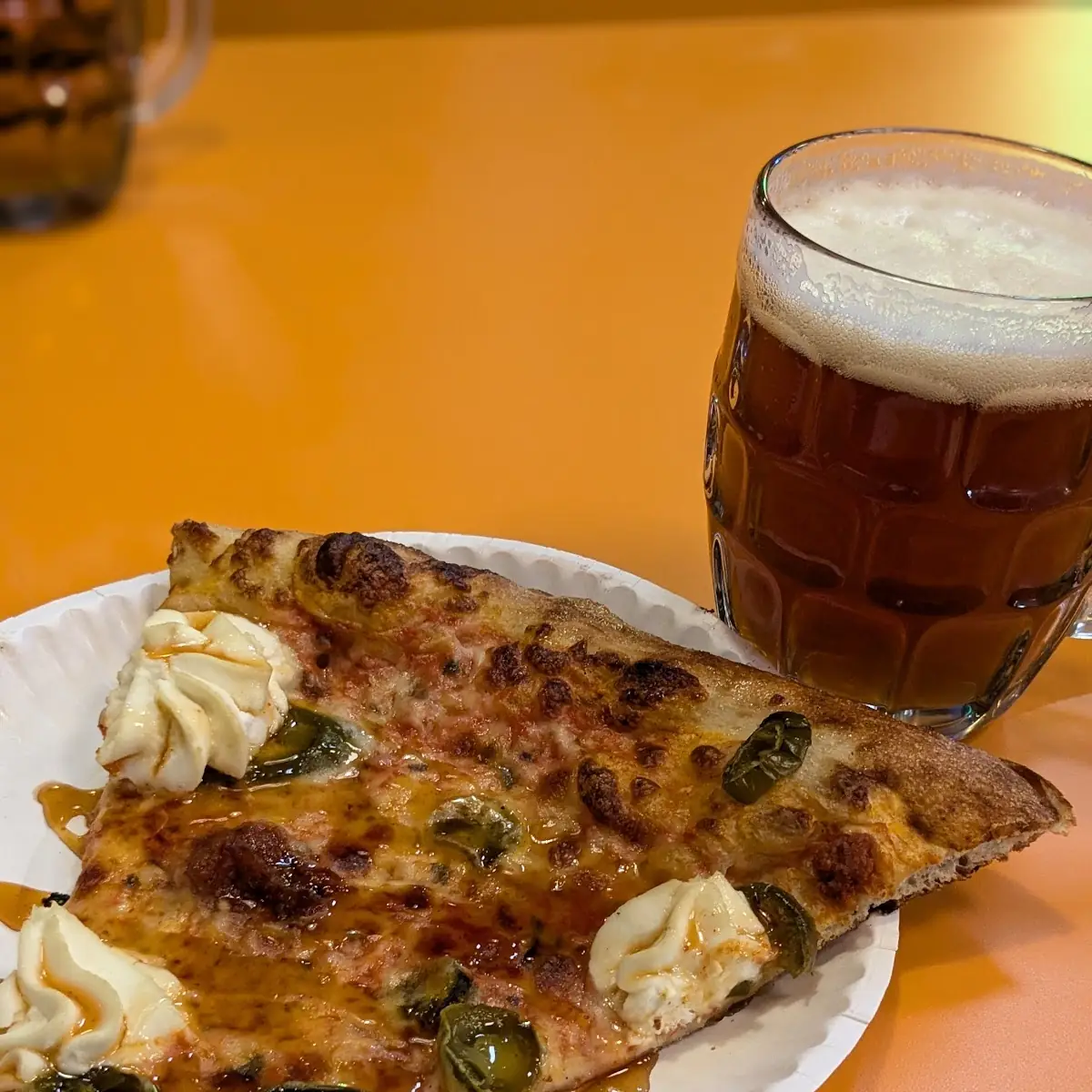 Two Pizza Slices and Beer