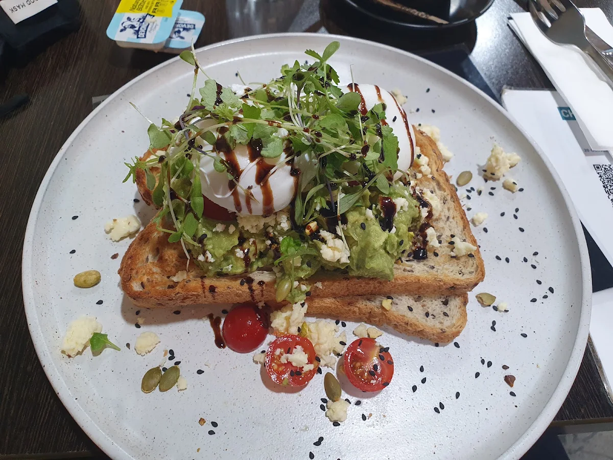 Smashed Avocado on Toast with Poached Eggs, Studio Coffee