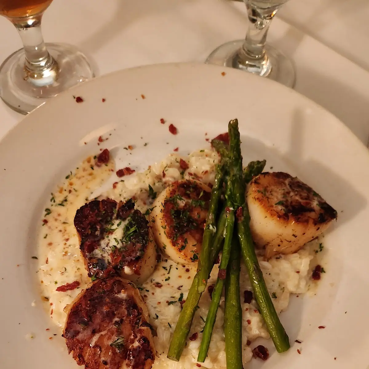 Sea Scallops over Mushroom Parmesan Risotto and Tomato Butter Sauce