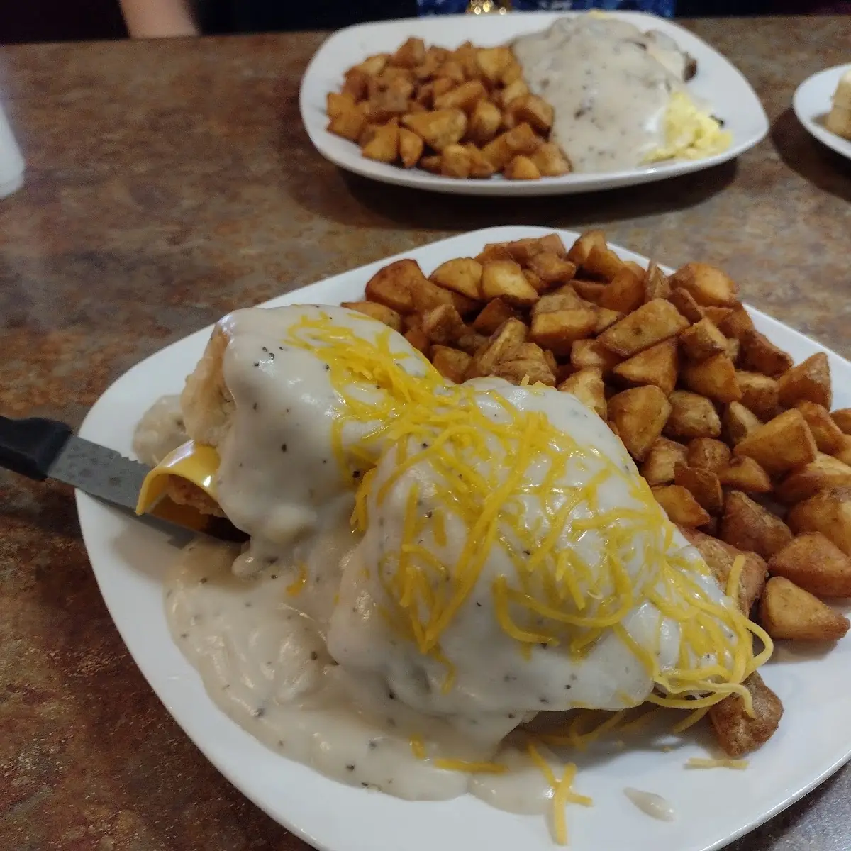 Chicken Biscuit Sandwich with Gravy and Breakfast Potatoes