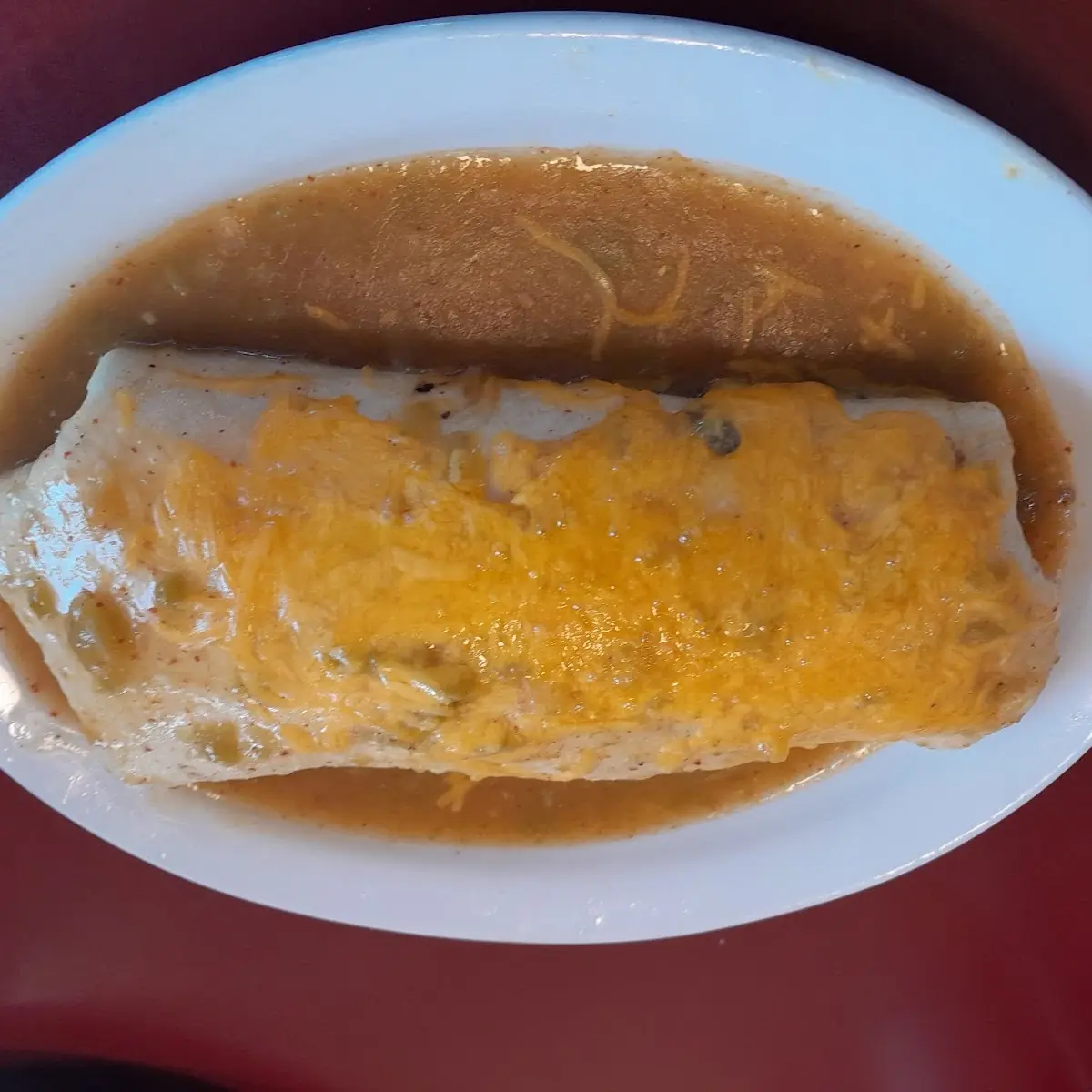 Breakfast Burrito Smothered in Green Chile