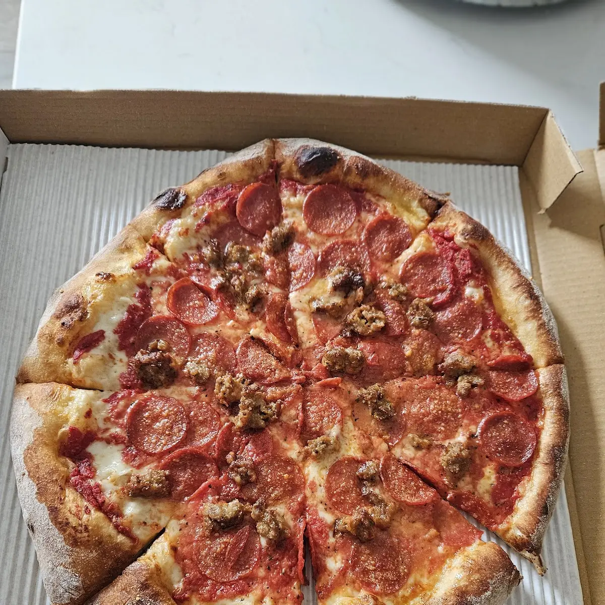 Pepperoni and Hot Sausage Pizza
