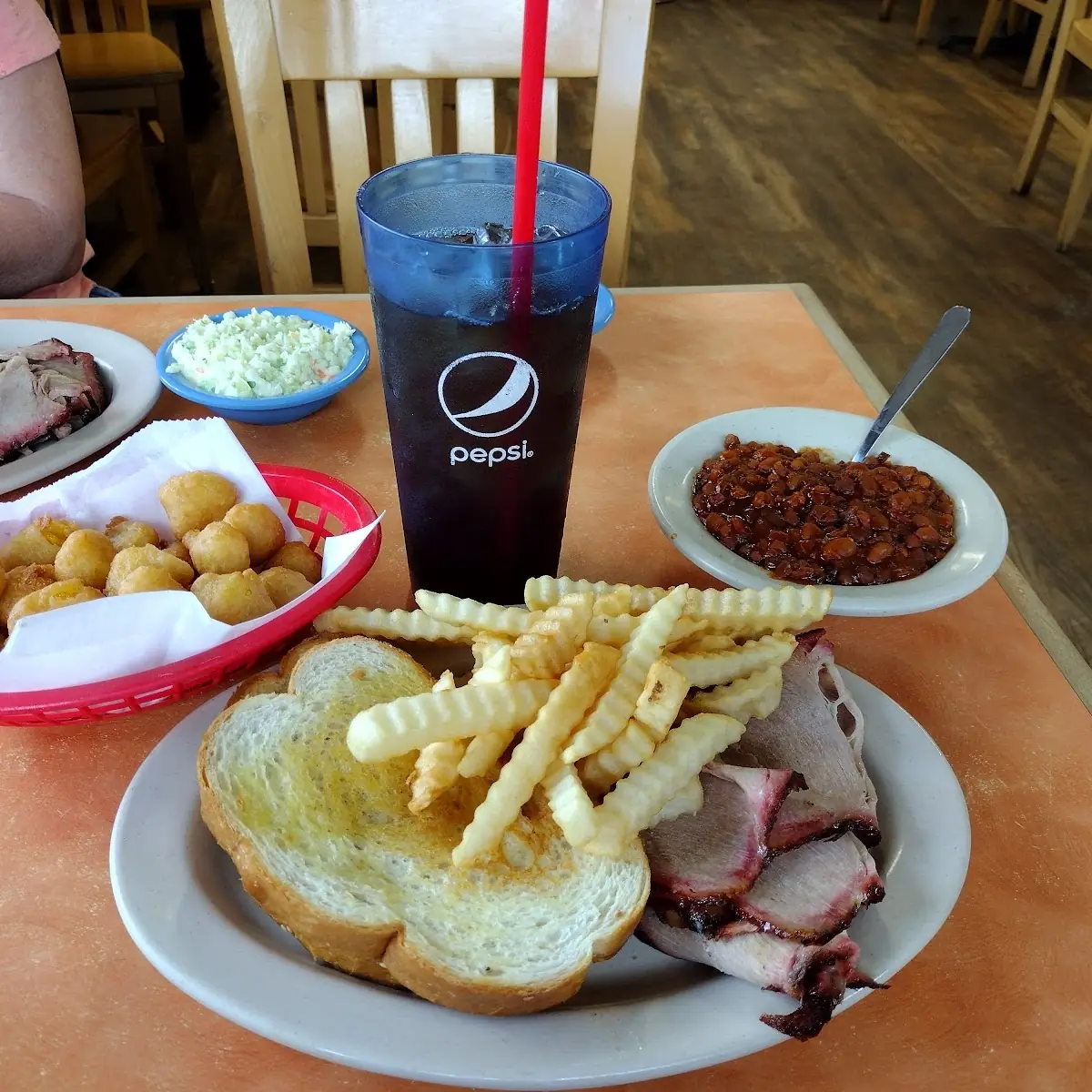 Pulled Pork Sandwich with Kringle Fries Corn Nuggets and Sweet Iced Tea