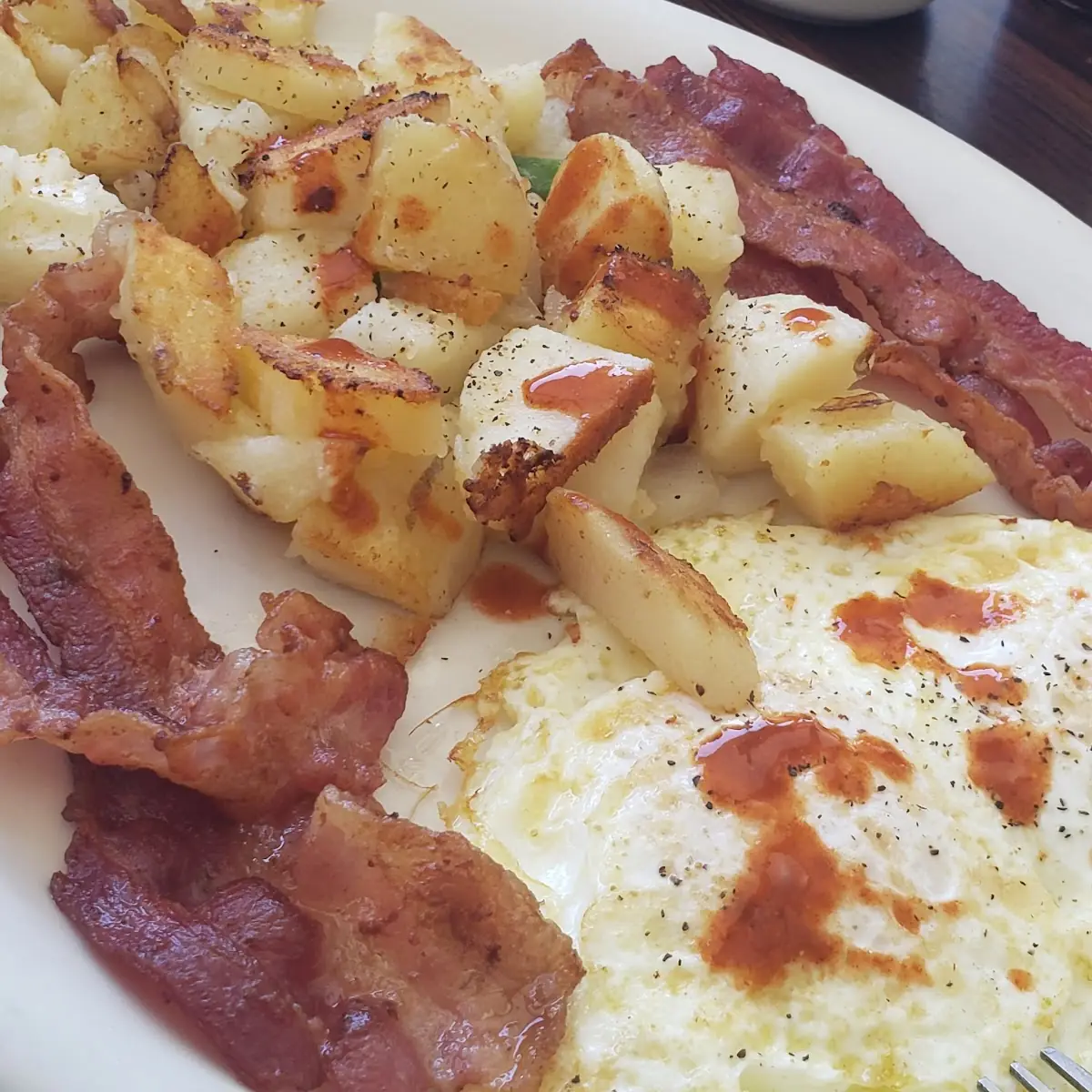 Potatoes Crispy Bacon and Eggs over Medium