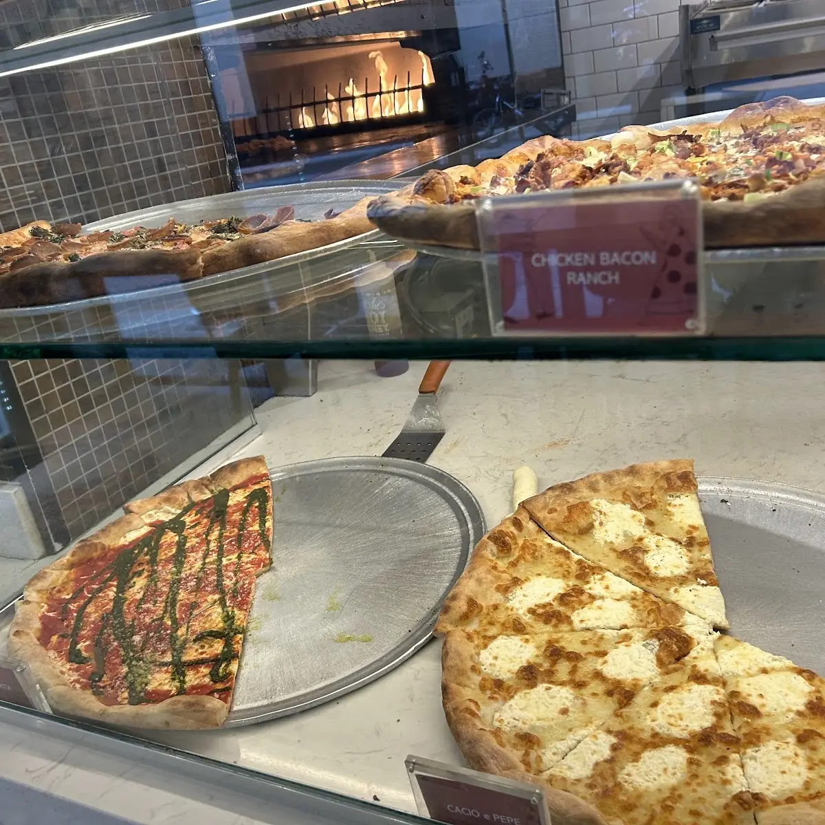 Assorted Pizza Slices on Display