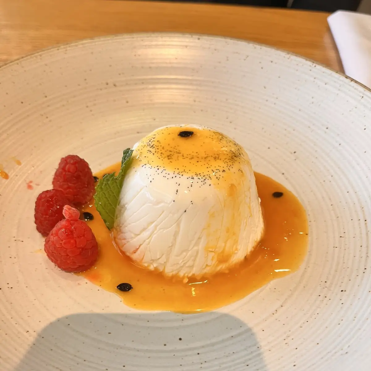 Vanilla Bean Panna Cotta with Passion Fruit Reduction
