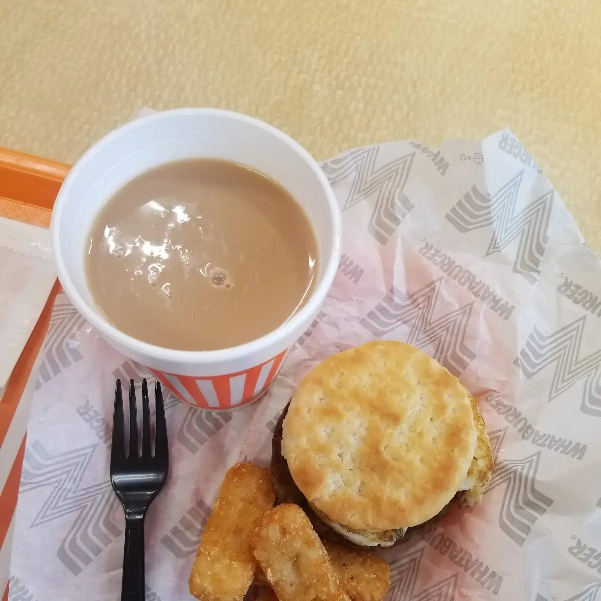 Breakfast Sandwich Hash Browns and Coffee