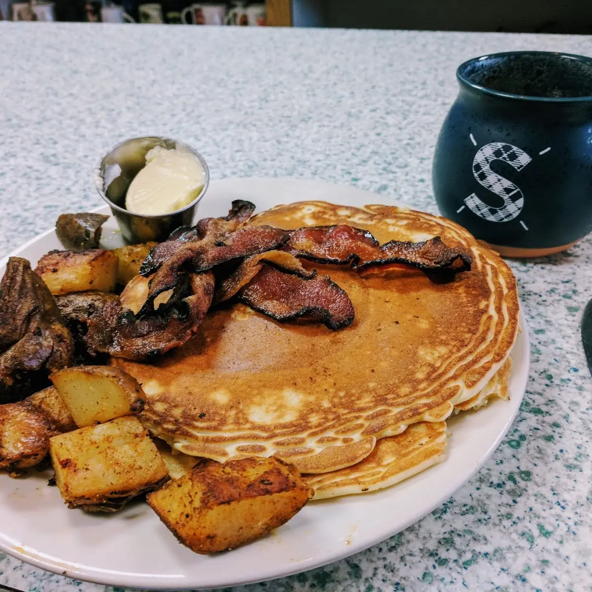 Pancakes Eggs Bacon and Potatoes