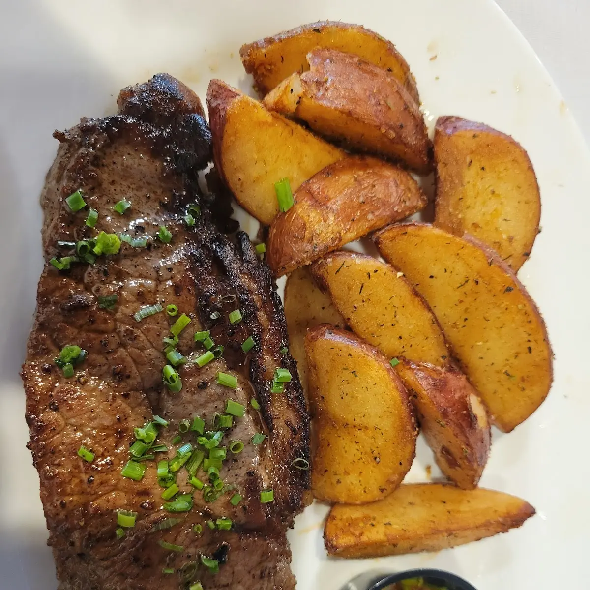 Peppered Strip Steak and Jojo Potato Wedges