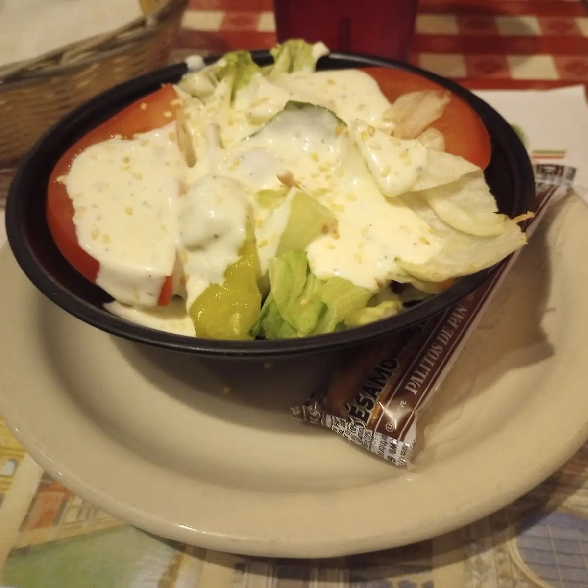 House with House Made Dressing and Garlic Bread Sticks