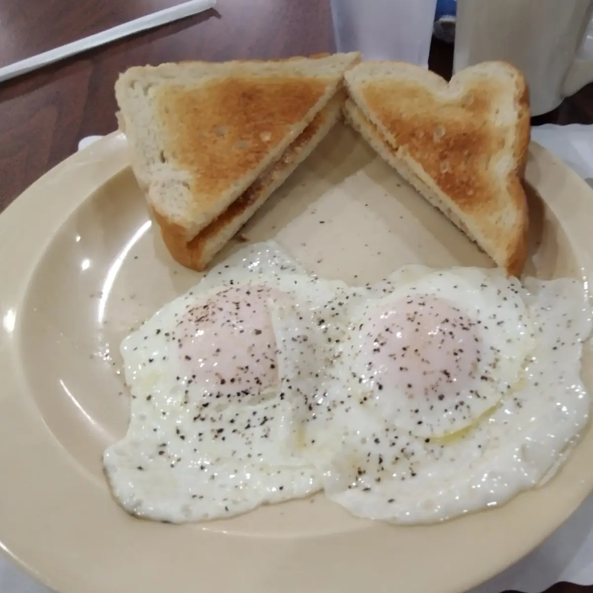 Eggs over Easy Buttered Toast Coffee