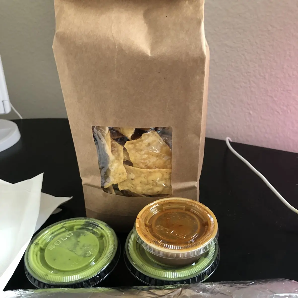 Chicken Burrito with Everything and a Side of Chips with Green Sauce