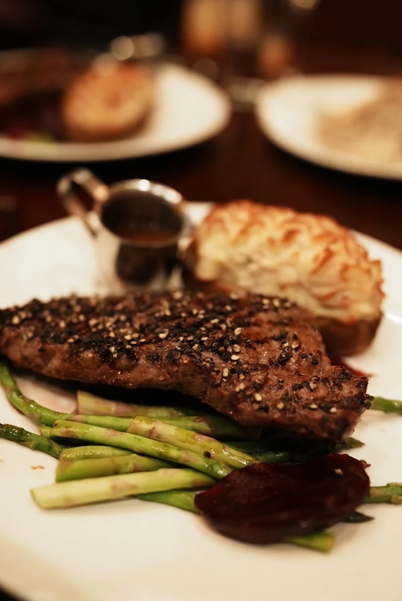 Rib Steak Lobster Tail and Fully Loaded Baked Potato
