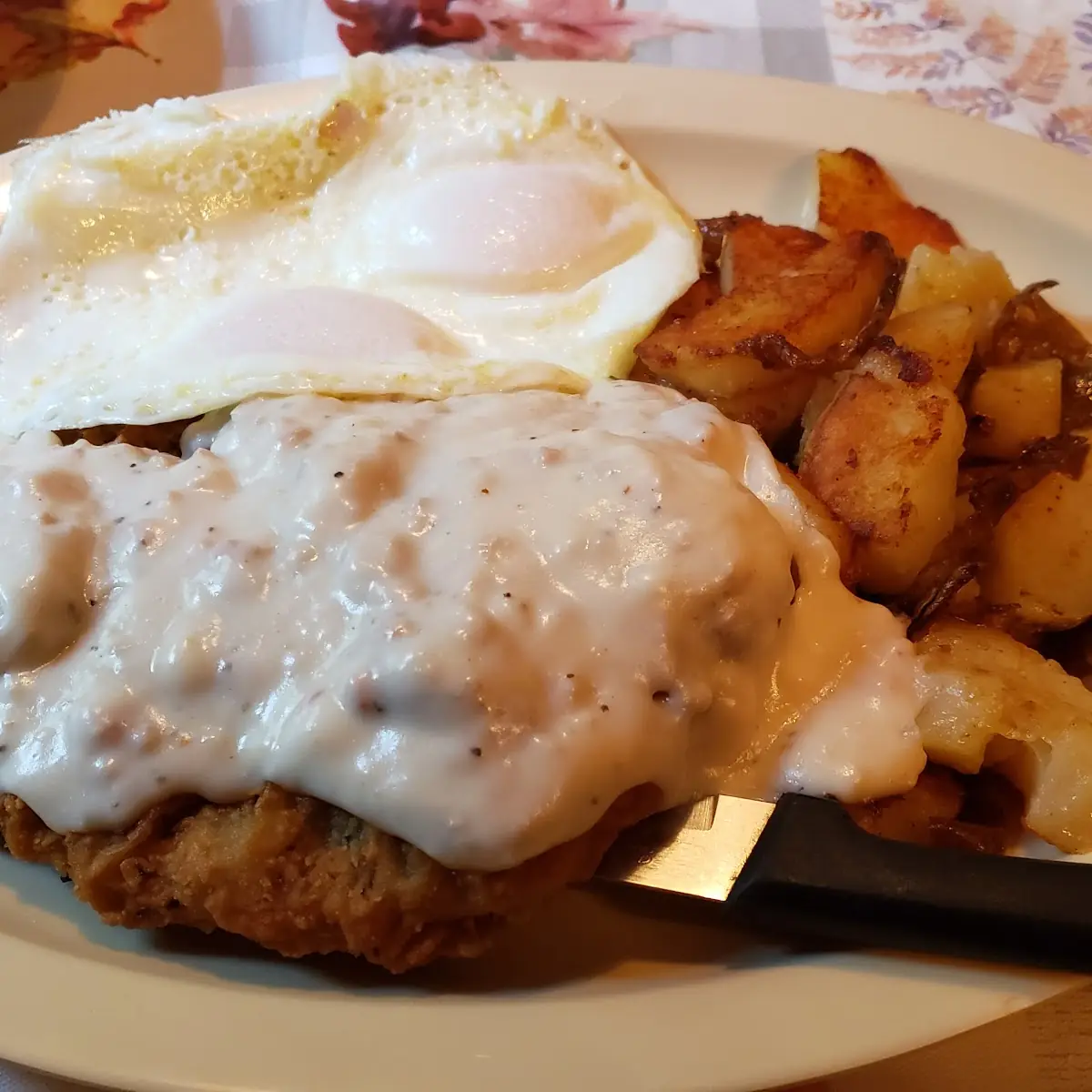 Country Fried Steak and Eggs over Easy with Potatoes