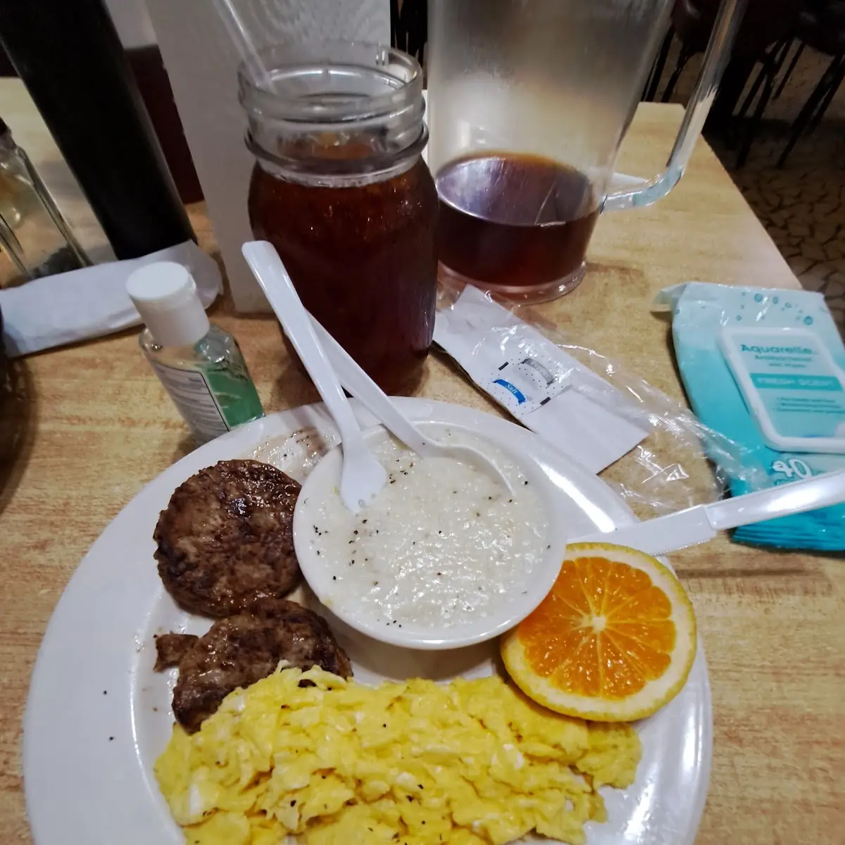 Eggs Sausage Patty Biscuits and Grits