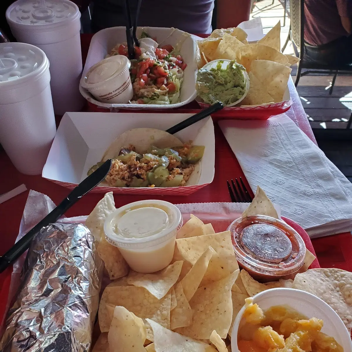 Burrito and Chips with Queso Dip and a Soft Pulled Pork Taco