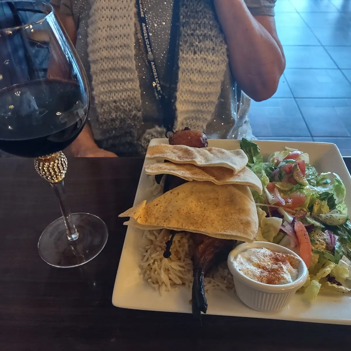 Lamb Chops Rice Pilaf Salad and Pita Bread with a Nice Red Dry Wine