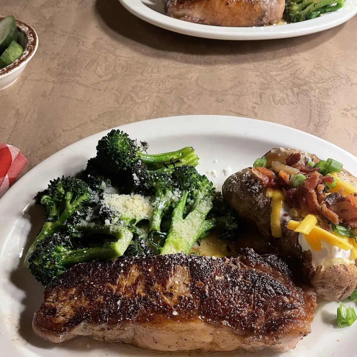 Beef New York Strip Broccoli and a Loaded Baked Potato