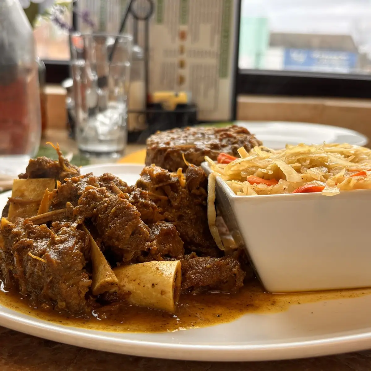 Curry Goat with Rice & Peas and Cabbage