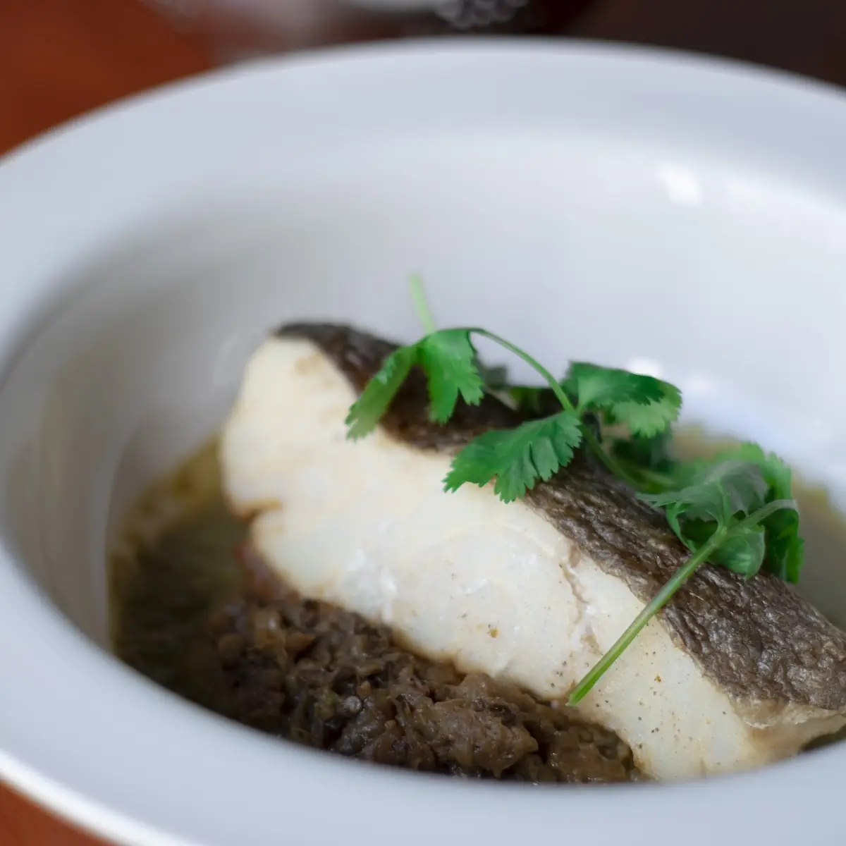 Fresh Cod Fish Fillet Served with Eggplant Caviar and Coriander Broth