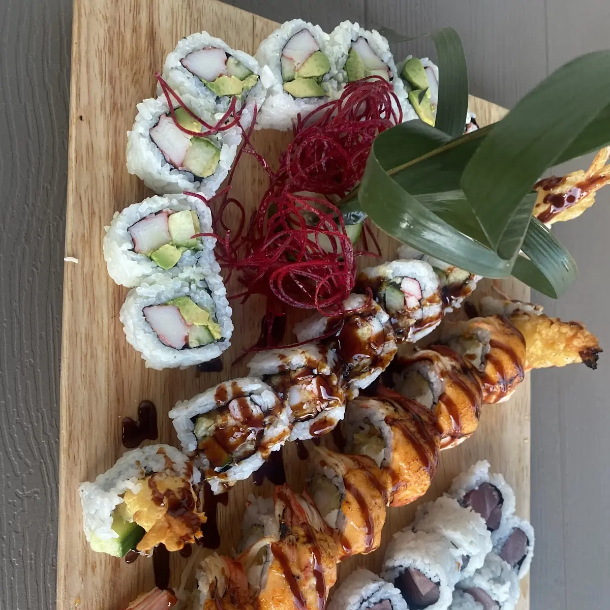 Assorted Sushi Rolls on Wooden Platter