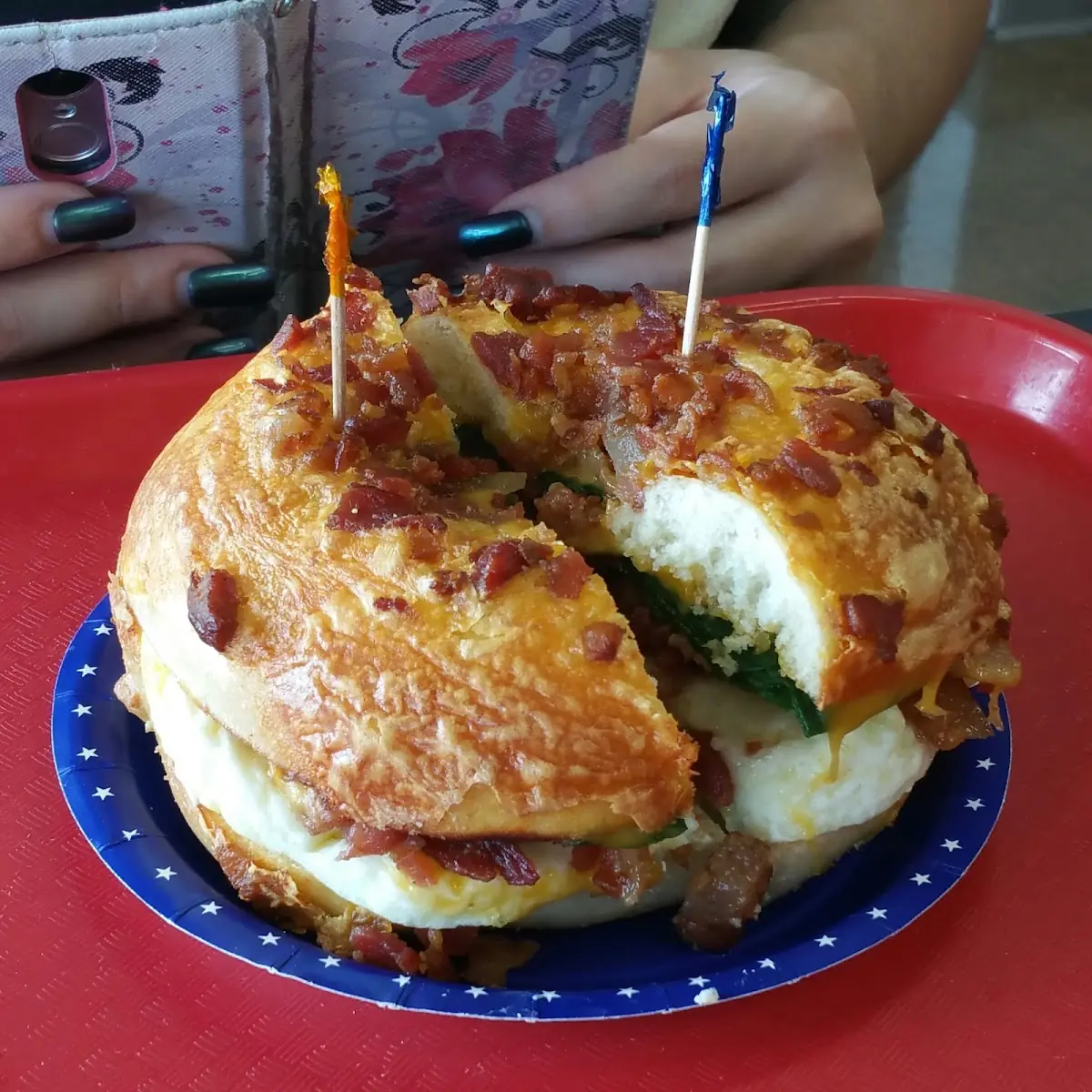 Popeye Omelette on Bacon Cheddar Bagel