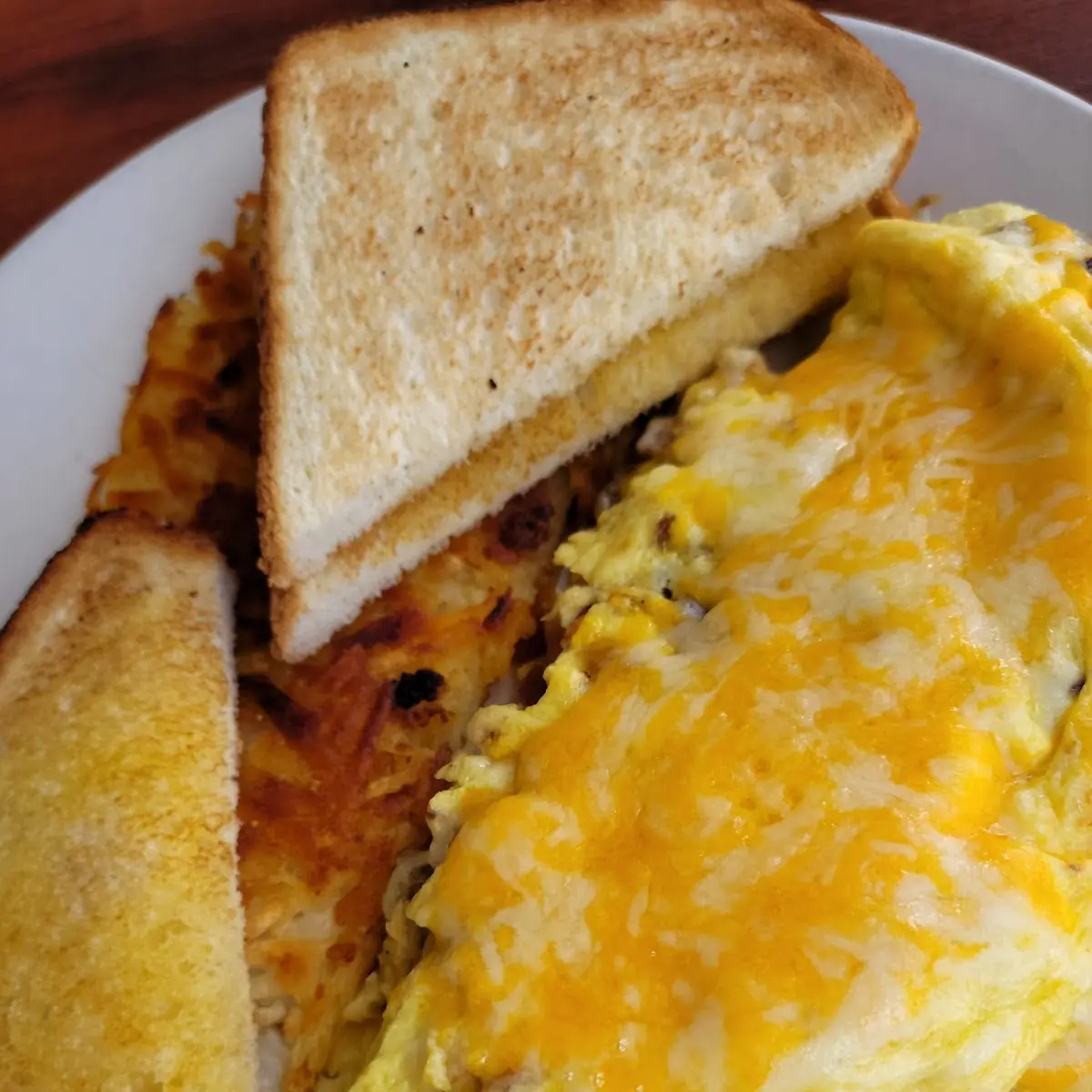 One Scrambled Egg Hash Browns & One Slice of Toast